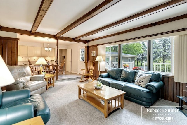 9409 Whitneyville Ave SE, Alto, MI 49302 - living area with beam ceiling, a chandelier, and light carpet