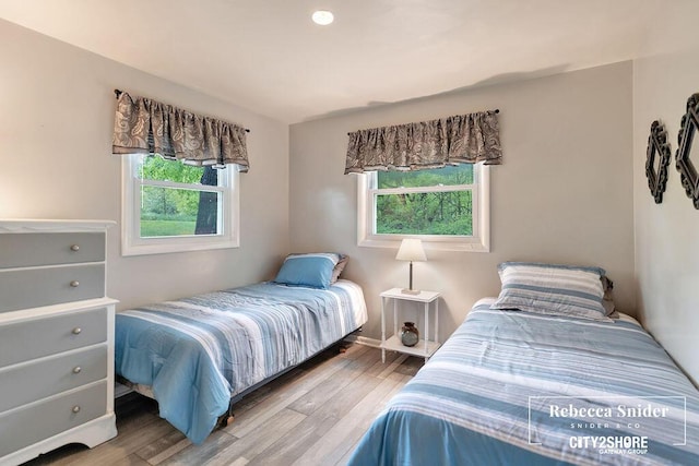 9409 Whitneyville Ave SE, Alto, MI 49302 - bedroom featuring wood finished floors and baseboards