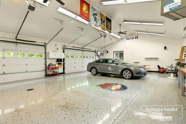 9409 Whitneyville Ave SE, Alto, MI 49302 - garage featuring a garage door opener