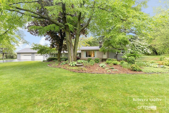 9409 Whitneyville Ave SE, Alto, MI 49302 - view of front of property with a garage and a front yard