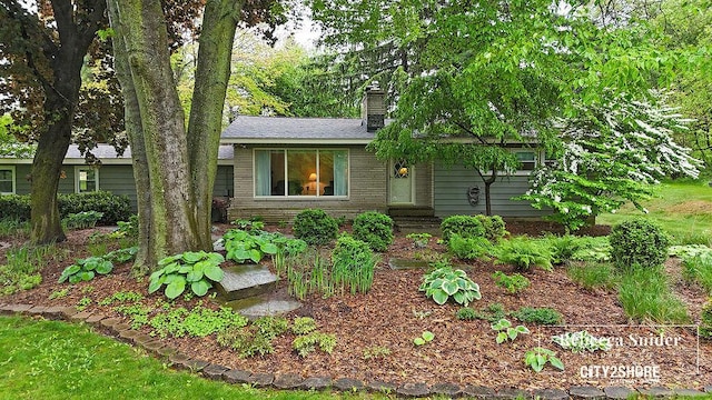 9409 Whitneyville Ave SE, Alto, MI 49302 - view of front facade with a chimney