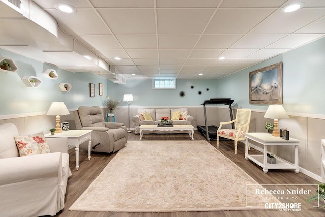 9409 Whitneyville Ave SE, Alto, MI 49302 - living area featuring wood finished floors, wainscoting, and a paneled ceiling