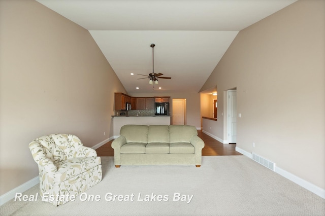 32 Tuscany Cir, Saginaw, MI 48603 - living area featuring lofted ceiling, ceiling fan, dark carpet, and recessed lighting