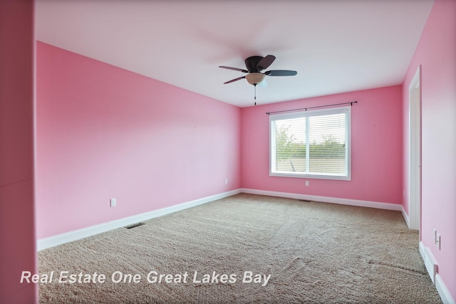 32 Tuscany Cir, Saginaw, MI 48603 - unfurnished room featuring carpet floors, baseboards, and ceiling fan