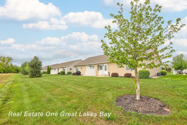 32 Tuscany Cir, Saginaw, MI 48603 - view of front of house with a front lawn and central AC