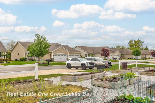 32 Tuscany Cir, Saginaw, MI 48603 - view of yard featuring a residential view, driveway, and a garage