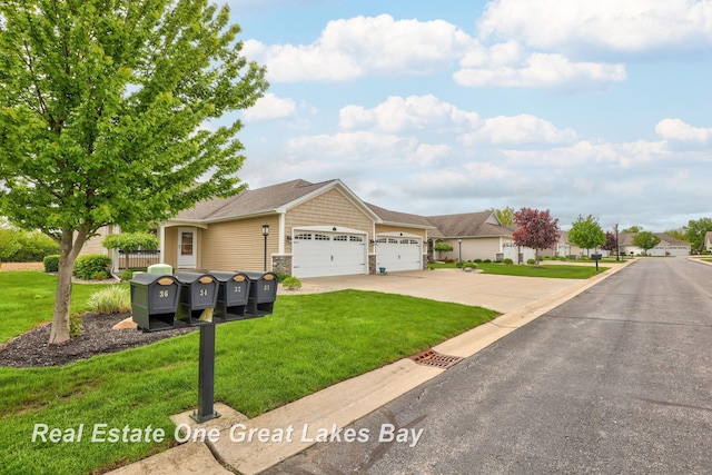 32 Tuscany Cir, Saginaw, MI 48603 - view of front of property featuring a garage, driveway, a front yard, and stone siding