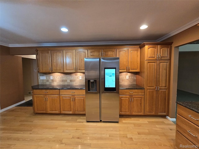 31929 Cambridge Dr, Clinton Township, MI 48093 - kitchen with stainless steel fridge, ornamental molding, brown cabinets, and recessed lighting
