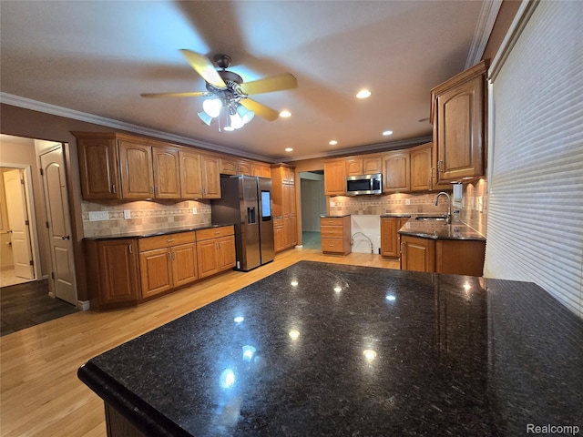 31929 Cambridge Dr, Clinton Township, MI 48093 - kitchen featuring appliances with stainless steel finishes, crown molding, ceiling fan, backsplash, and a sink