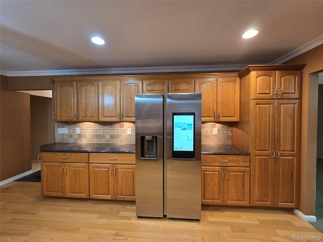 31929 Cambridge Dr, Clinton Township, MI 48093 - kitchen featuring stainless steel refrigerator with ice dispenser, ornamental molding, backsplash, light wood-style flooring, and baseboards