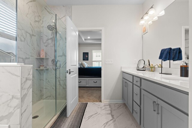 2771 Silo Dr, Saline, MI 48176 - ensuite bathroom with marble look tile flooring, a marble finish shower, double vanity, and baseboards
