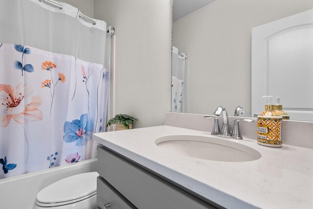 2771 Silo Dr, Saline, MI 48176 - full bath featuring vanity, toilet, and shower / tub combo with curtain