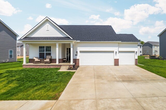 2771 Silo Dr, Saline, MI 48176 - view of front of property featuring an outdoor living space, a front yard, a garage, driveway, and brick siding