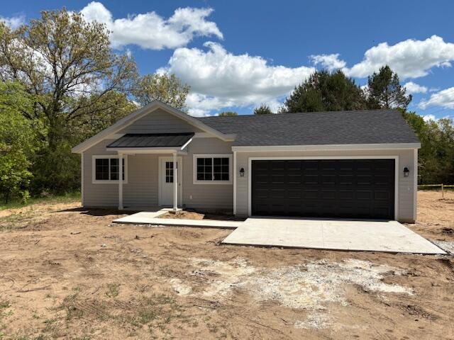 8121 Bowens Mill Rd, Middleville, MI 49333 - ranch-style house with a garage and driveway