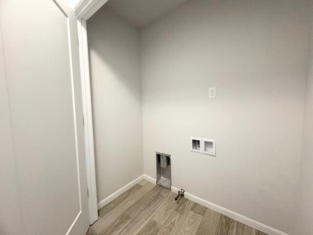 8121 Bowens Mill Rd, Middleville, MI 49333 - laundry room featuring light wood-style flooring, washer hookup, and baseboards
