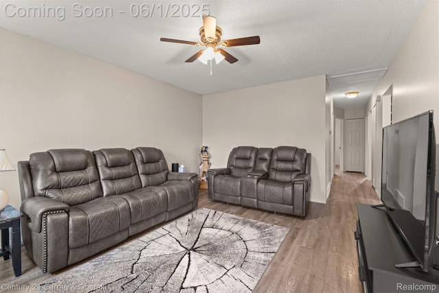 5908 Gilman St, Garden City, MI 48135 - living area with attic access, ceiling fan, and wood finished floors
