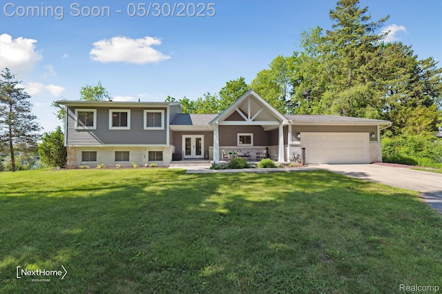 47400 W Huron River Dr, Van Buren, MI 48111 - split level home featuring french doors, a garage, driveway, and a front yard