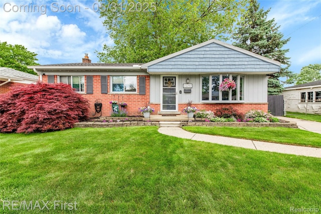 26242 Audrey Ave, Warren, MI 48091 - view of front facade with brick siding, a chimney, and board and batten siding