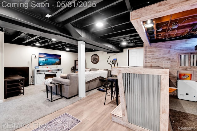 26242 Audrey Ave, Warren, MI 48091 - living room featuring a bar, wooden walls, and wood finished floors