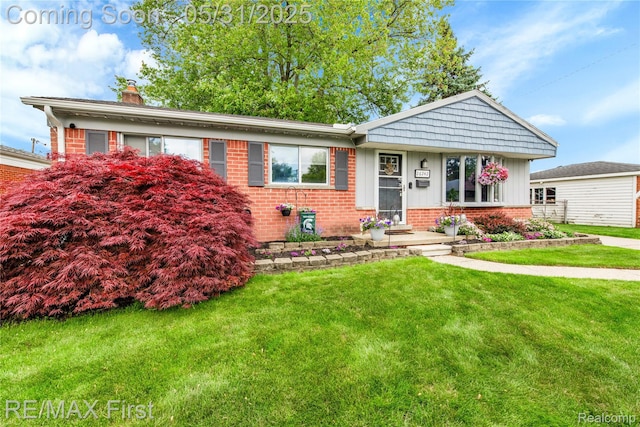 26242 Audrey Ave, Warren, MI 48091 - view of front of house featuring brick siding, a front lawn, a chimney, and board and batten siding