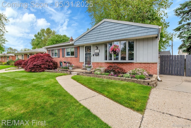 26242 Audrey Ave, Warren, MI 48091 - view of front of home with brick siding, board and batten siding, and a chimney