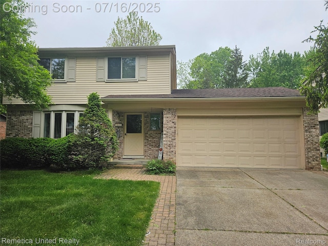3455 Harmony Dr, Troy, MI 48083 - traditional-style home featuring driveway, brick siding, an attached garage, and a front yard