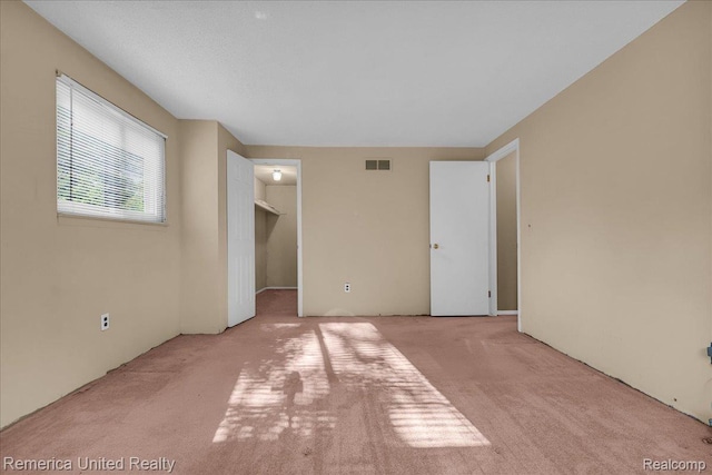 3455 Harmony Dr, Troy, MI 48083 - unfurnished bedroom with carpet flooring and a spacious closet