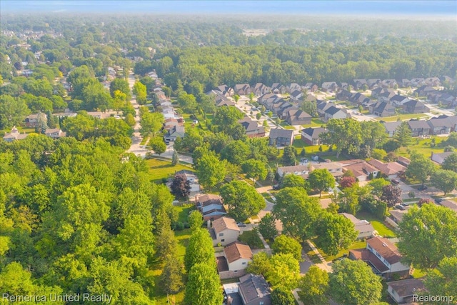 3455 Harmony Dr, Troy, MI 48083 - aerial view of property and surrounding area with a forest and nearby suburban area