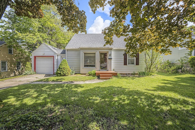 537 Wolverine Dr NE, Grand Rapids, MI 49505 - view of front of property with a shingled roof, driveway, a front lawn, an outdoor structure, and a garage