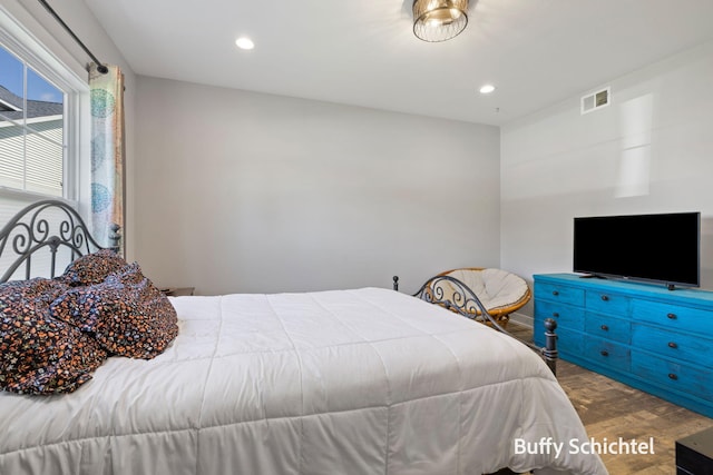 334 Terrace Point Cir Unit 33, Muskegon, MI 49440 - bedroom with wood finished floors and recessed lighting