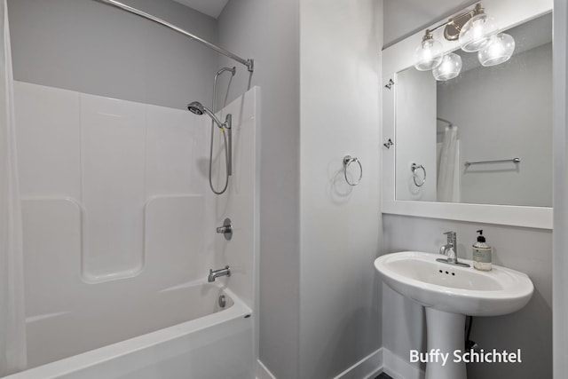334 Terrace Point Cir Unit 33, Muskegon, MI 49440 - bathroom featuring shower / bath combo and baseboards