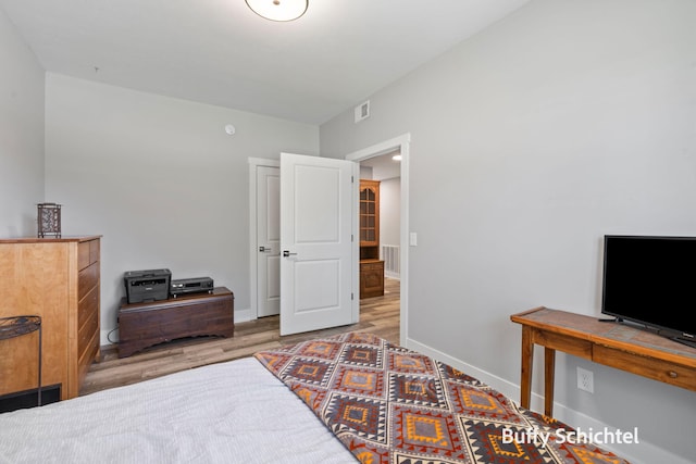 334 Terrace Point Cir Unit 33, Muskegon, MI 49440 - bedroom with wood finished floors and baseboards