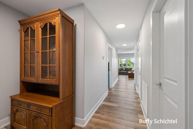 334 Terrace Point Cir Unit 33, Muskegon, MI 49440 - hallway featuring light wood-style floors, baseboards, and recessed lighting