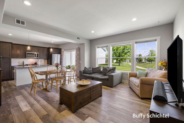 334 Terrace Point Cir Unit 33, Muskegon, MI 49440 - living area with recessed lighting and wood finished floors