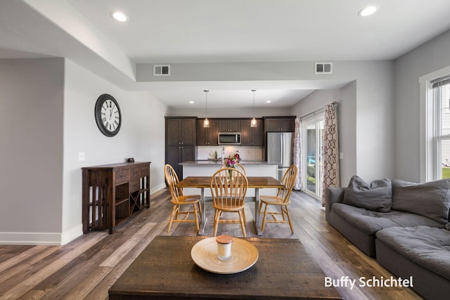 334 Terrace Point Cir Unit 33, Muskegon, MI 49440 - dining room featuring dark wood-style flooring, healthy amount of natural light, recessed lighting, and baseboards