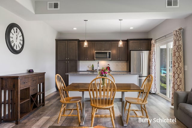 334 Terrace Point Cir Unit 33, Muskegon, MI 49440 - dining area with dark wood-style flooring, recessed lighting, and baseboards