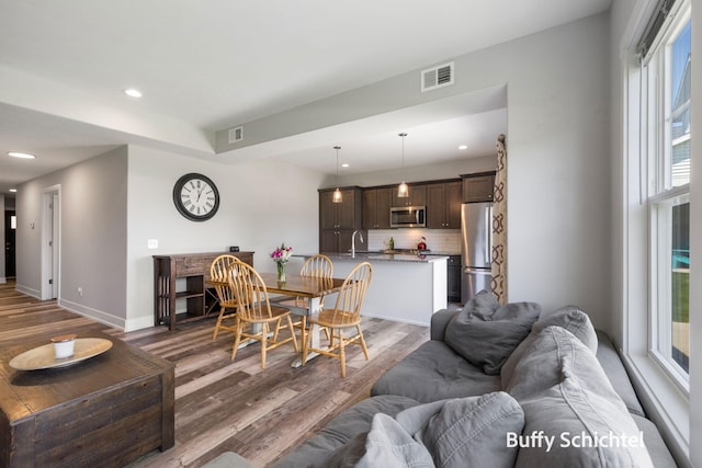 334 Terrace Point Cir Unit 33, Muskegon, MI 49440 - dining space with wood finished floors, recessed lighting, and baseboards