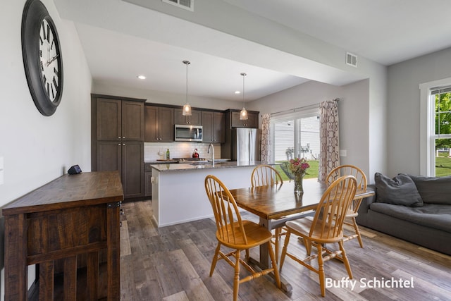 334 Terrace Point Cir Unit 33, Muskegon, MI 49440 - dining area featuring dark wood-type flooring and recessed lighting