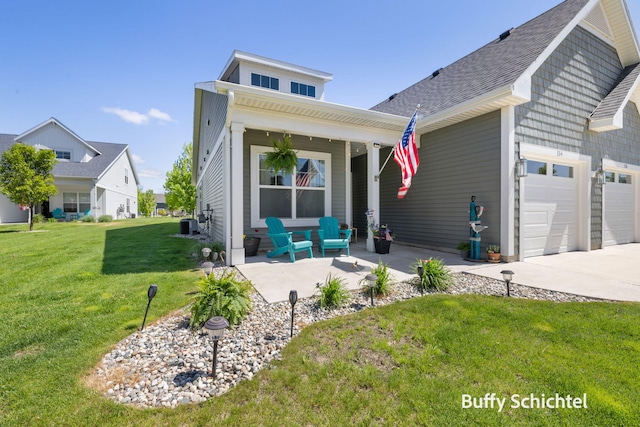 334 Terrace Point Cir Unit 33, Muskegon, MI 49440 - view of front of house with a front yard, covered porch, driveway, an attached garage, and central AC