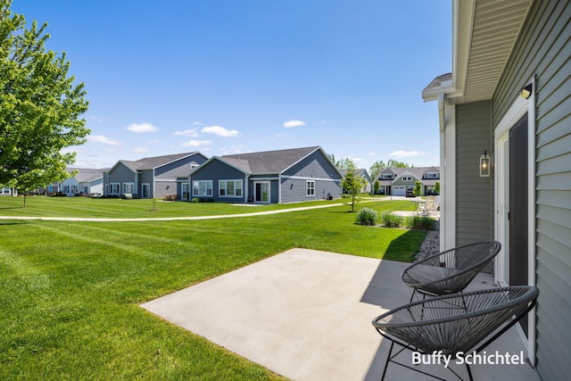334 Terrace Point Cir Unit 33, Muskegon, MI 49440 - view of grassy yard with a residential view and a patio area