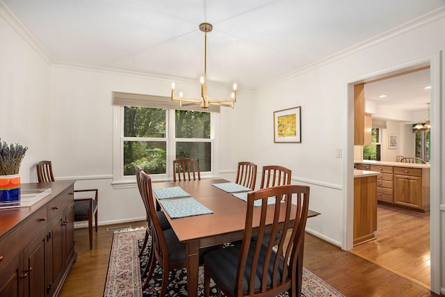 3509 Sulgrave Pl, Ann Arbor, MI 48105 - dining space with a chandelier, wood finished floors, and crown molding