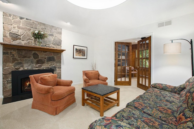 3509 Sulgrave Pl, Ann Arbor, MI 48105 - living area with light colored carpet, a stone fireplace, and baseboards