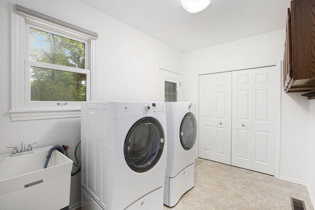 3509 Sulgrave Pl, Ann Arbor, MI 48105 - laundry area featuring cabinet space and washing machine and dryer