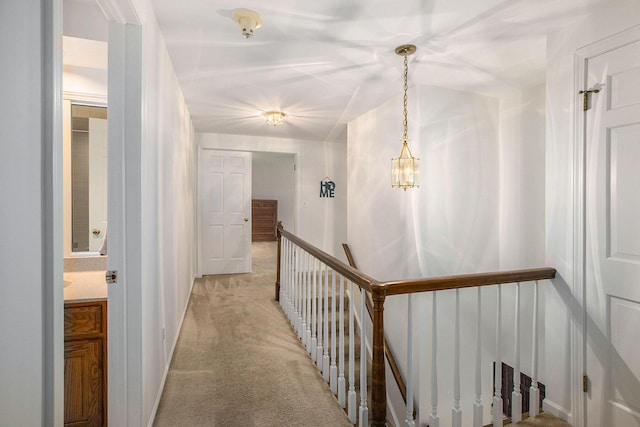 3509 Sulgrave Pl, Ann Arbor, MI 48105 - hallway featuring an upstairs landing, light colored carpet, and baseboards