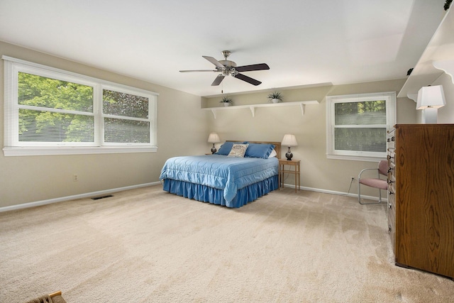 3509 Sulgrave Pl, Ann Arbor, MI 48105 - carpeted bedroom featuring baseboards, multiple windows, and ceiling fan