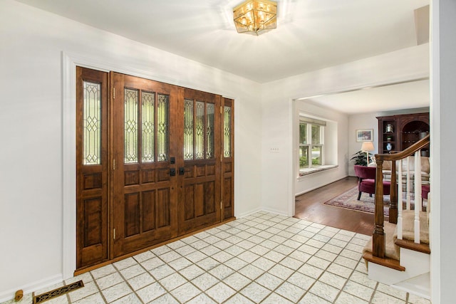 3509 Sulgrave Pl, Ann Arbor, MI 48105 - entrance foyer with light tile patterned floors and baseboards
