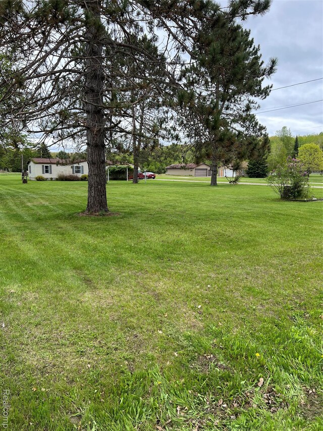 6858 W Emery Rd, Houghton Lake, MI 48629 - view of green lawn
