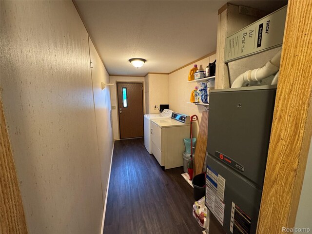 6858 W Emery Rd, Houghton Lake, MI 48629 - laundry room featuring washer and clothes dryer and dark wood-style floors