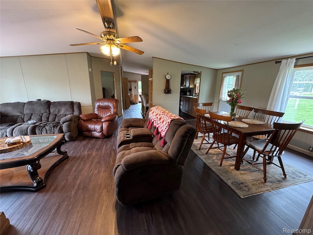 6858 W Emery Rd, Houghton Lake, MI 48629 - living area featuring wood finished floors, lofted ceiling, and a ceiling fan