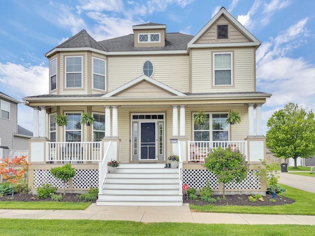 4315 Astoria Ave SE, Grand Rapids, MI 49512 - victorian house featuring covered porch and a shingled roof